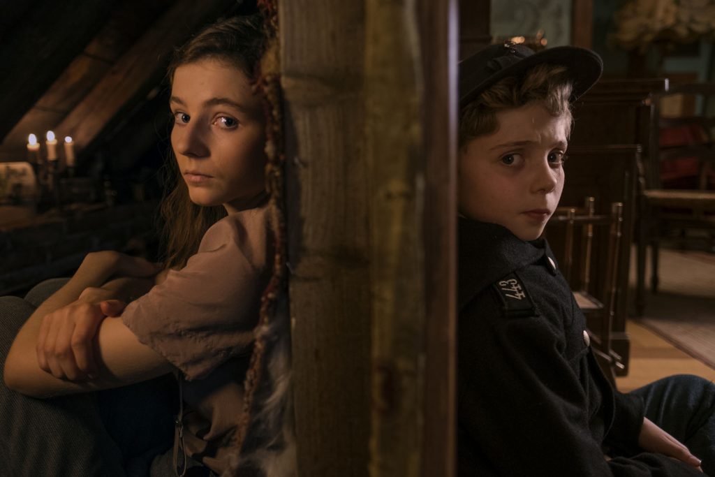 Thomasin McKenzie and Roman Griffin Davis in the film JOJO RABBIT. Photo by Kimberley French. © 2019 Twentieth Century Fox Film Corporation All Rights Reserved